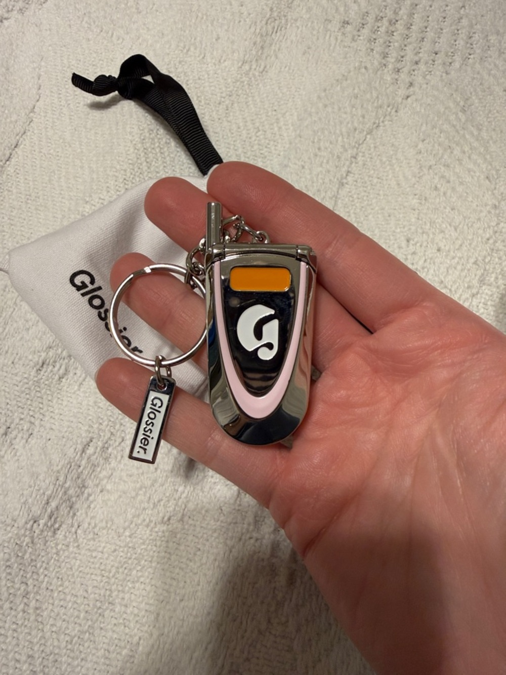 Glossier Mini Flip Phone Keychain in Light Pink - Picture 2 of 2